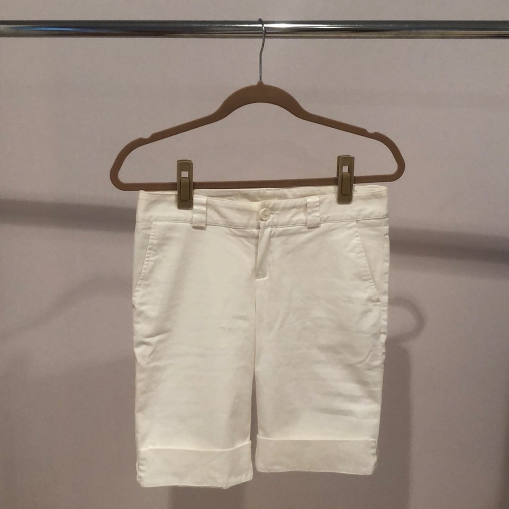 Crisp white Lacoste Bermuda shorts